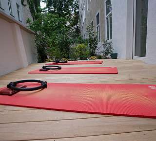 Pilates mats training on terrace