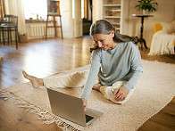 Woman doing Pilates online lessons