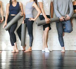 Pilates group with mats